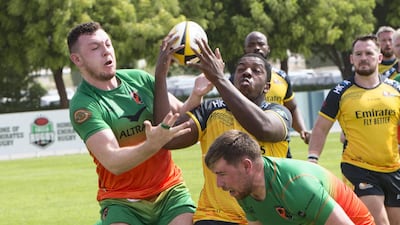 Players vie for the ball during the match between Dubai Hurricanes and Dubai Knight Eagles at The Sevens. All images Leslie Pableo/The National
