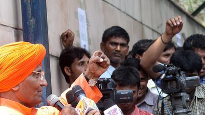 August 18, 2011: Indian scholar and social activist Swami Agnivesh (L) addresses the media representatives outside the Tihar prisons before meeting Indian social activist Anna Hazare (unseen) inside the Tihar prison where Anna is on his hunger strike in N???