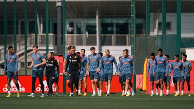 Manchester United's Marcus Rashford, Scott McTominay, coach Steve McClaren, technical director Darren Fletcher, Victor Lindelof, Donny van de Beek, Christian Eriksen, Raphael Varane, Lisandro Martinez and Anthony Elanga during a training session at Carrington Training Ground. All pictures Getty Images