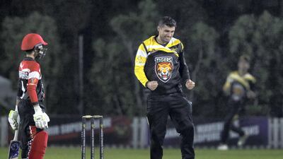 Tigers' Babar Iqbal takes the wicket of Panthers' Usman Mushtaq. Chris Whiteoak / The National