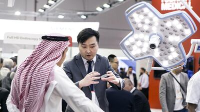 A visitor on Monday inspects an operating table at Toshiba Medical’s booth at the 13th Arab Health Congress in Dubai, the largest meeting of health professionals in the region. Reem Mohammed / The National