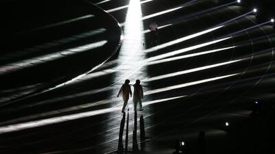 Saudis walk during the opening ceremony of the 22nd Gulf Cup football tournament prior to Saudi Arabia’s match against Qatar in Riyadh on November 13, 2014. Eight nations are taking part in the games including Oman, UAE, Kuwait, Yemen, Bahrain, Iraq, Saudi Arabia and Qatar. AFP PHOTO/KARIM SAHIB