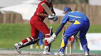 Shahid Afridi of Fly Emirates, in red, bats against the Cape Cobras in Dubai yesterday.