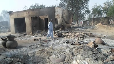 A man walks past burnt out houses following an attack by Boko Haram in Dalori village 5 kilometers from Maiduguri, Nigeria on January 31, 2016. Jossy Ola/AP Photo