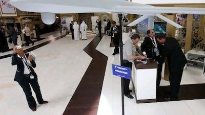 A model of the Predator XP is displayed at the General Atomics Aeronautical booth at Idex.