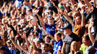Leicester City fans cheer during their team's match against Arsenal in the Premier League on Sunday. Laurence Griffiths / Getty Images