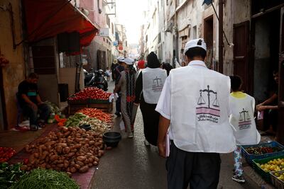Supporters of the Party of Istiqlal walk the street of Deb Sultane in El Fida district during a campaign tour in Casablanca, Morocco. AFP