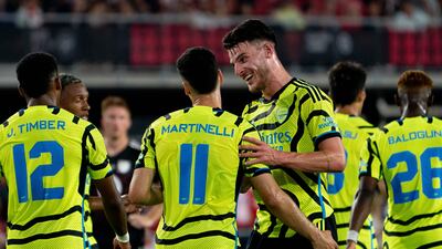 Arsenal's Declan Rice celebrates with teammate Gabriel Martinelli after Martinelli scored the Gunners' fourth in a pre-season friendly against an MLS All-Star team at Audi Field in Washington, DC. AFP