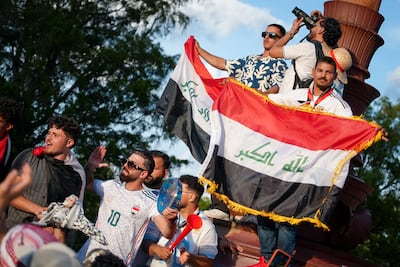 Iraqi fans wave the flag on the Rocky Steps in Philadelphia. Joshua Longmore / The National