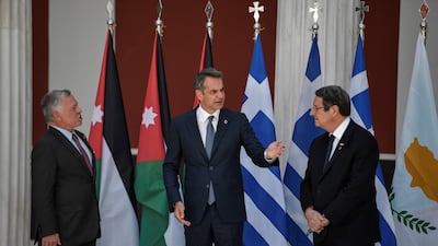 King Abdullah II, Kyriakos Mitsotakis and Nikos Anastasiades talk to one another before their trilateral meeting.