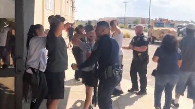 People are evacuated from Cinergy Odessa cinema following a shooting in Odessa, Texas, U.S. in this still image taken from a social media video. REUTERS