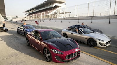 Owners with their Maseratis in the pit lane at the Autodrome. Antonie Robertson / The National