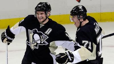 Evgeni Malkin, right, was one of the heroes for the Pittsburgh Penguins in Game 1. Gene J Puskar / AP Photo