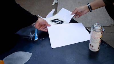 First-year applied media students at Ras Al Khaimah Women’s College put the finishing touches to their graffiti art posters that will be on display as part of the National Day celebrations.
