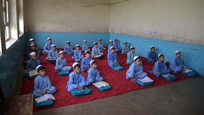 Afghan junior schoolboys attend class at a high school in the southern city of Kandahar. AFP