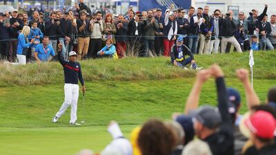 Tony Finau of the United States chips in for eagle on the sixth during the morning fourball matches at the Ryder Cup. Getty Images
