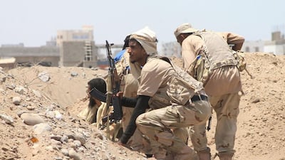 Yemeni members of the southern separatist movement, loyal to President Abdrabu Mansur Hadi, hold their positions in Aden's suburbs, on June 3. Mr Hadi has been training thousands of troops to try and match the Houthis rebels and their allies. AFP PHOTO