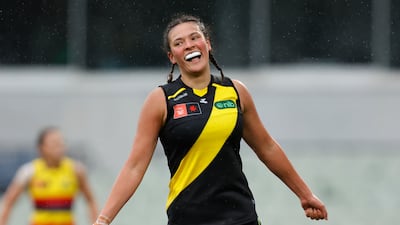 Richmond Tigers player Poppy Kelly celebrates a goal during an AFL Women's match against Adelaide Crows in Australia. Getty Images