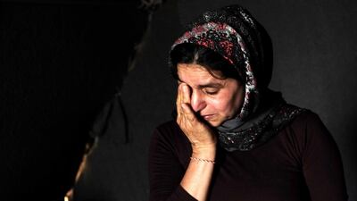 Yazidi ethnic Naam Murad, 43, cries in her room at a refugees camp in Khanke town, northern Iraq. EPA