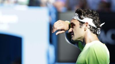 Roger Federer reacts during his Australian Open third round loss to Andreas Seppi on Friday in Melbourne. Barbara Walton / EPA / January 23, 2015