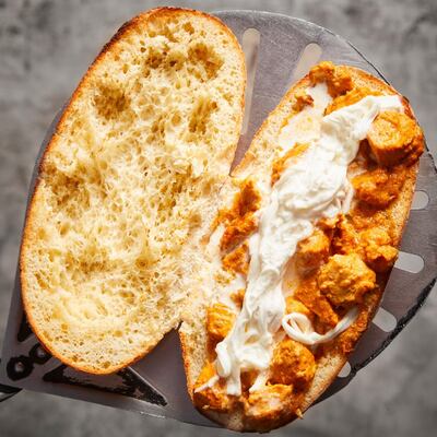 Butter chicken + burrata = bliss. Photo: Gino’s Deli