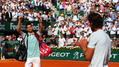 Novak Djokovic of Serbia applauds the fans as he walks off court applauded by Rafael Nadal of Spain after their men's singles semi-final match on day thirteen of the French Open at Roland Garros on June 7, 2013 in Paris, France. Julian Finney/Getty Images