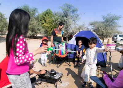 A family spending National Day at Al Qudra lake in 2019. Reem Mohammed / The National