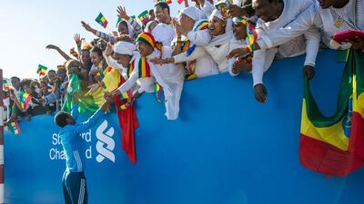 Lemi Berhanu Hayle greets his Ethiopian fans on Friday after winning the 2015 Dubai Marathon. Stephen Hindley / AP