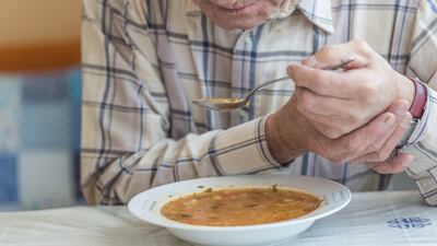 Tremors can make the most basic of tasks difficult for Parkinson's sufferers. Getty Images