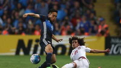 UAE's Omar Abdulrahman, right, tackles Yuto Nagatomo of Japan during the 2018 World Cup qualifying match at Hazza bin Zayed Stadium on March 23, 2017 in Al Ain City, UAE. Francois Nel / Getty Images