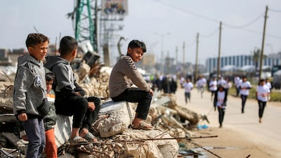 Children watch the race which was organised by the UAE.