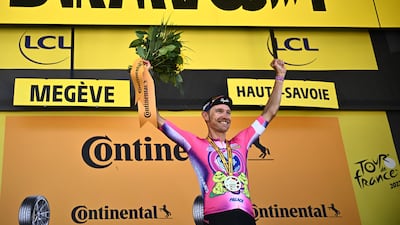 EF Education-Easypost rider Magnus Cort celebrates on the podium after winning Stage 10. AFP