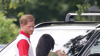Prince Harry, Meghan and Archie chat after the match. Getty Images
