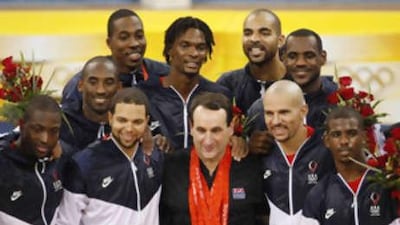The USA head coach Mike Krzyzewski wears his players' gold medals after they defeated Spain in the men's basketball finals at the Beijing 2008 Olympic Games.