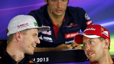 Ferrari Formula One driver Sebastian Vettel, right, says he was jealous and now has 'massive respect' for Force India Formula One driver Nico Hulkenberg, left, after his fellow German driver's victory at the 24 Hours of Le Mans. . Toro Rosso's Carlos Sainz Jr is seen in the background. Laszlo Balogh / Reuters
