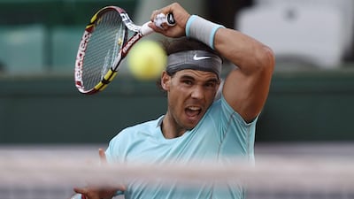 Rafael Nadal hits a return to David Ferrer during the French Open in June at Roland Garros. Dominique Faget / AFP / June 4, 2014