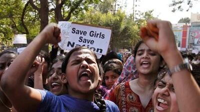 Indian students shout slogans during a protest rally in Hyderabad, India. The main suspect in the gang rape of a woman on a New Delhi bus has committed suicide in jail. AP Photo / Mahesh Kumar