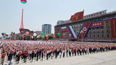 North Koreans at a welcoming ceremony for Mr Putin in Pyongyang. EPA / Sputnik