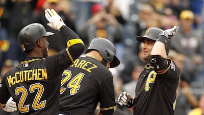 Francisco Cervelli, right, of the Pittsburgh Pirates celebrates with Andrew McCutchen, left, after hitting a grand slam in the fourth inning against the St Louis Cardinals at PNC Park on September 30, 2015 in Pittsburgh, Pennsylvania. Justin Aller/Getty Images