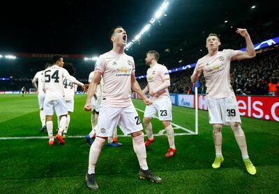 epa07418330 Manchester's Diogo Dalot (L) and Scott McTominay (R) celebrate after the UEFA Champions League round of 16 second leg soccer match between PSG and Manchester United at the Parc des Princes Stadium in Paris, France, 06 March 2019. EPA/IAN LANGSDON