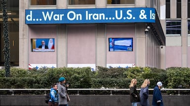 A news ticker announces US strikes on Iran in New York. The attack has divided Donald Trump's supporters. Bloomberg