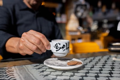 A customer drinks coffee at Al Kofeia Palestinian restaurant in Riyadh. Bloomberg
