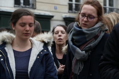 People pray near Notre-Dame Cathedral. Reuters