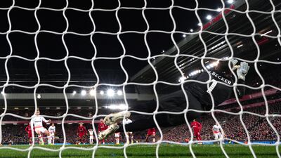 Liverpool goalkeeper Alisson Becker saves a penalty from West Ham's Jarrod Bowen. PA