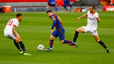 Barcelona's Lionel Messi runs at the Sevilla defence. Reuters