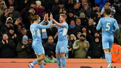 Kevin de Bruyne celebrates scoring Man City's second goal with substitute Jack Grealish. PA