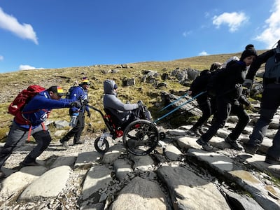 Martin Hibbert (centre), who was paralysed in the Manchester Arena attack.