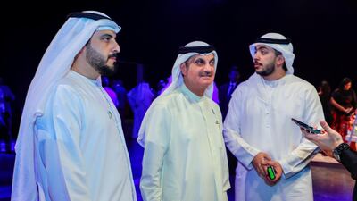 Visitors get their hands on the device.