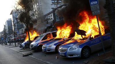 Four German police cars set on fire. Kai Pfaffenbach / Reuters