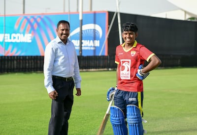 Ethan D'Souza with his father John D'Souza at Zayed Cricket Stadium, Abu Dhabi. Khushnum Bhandari / The National